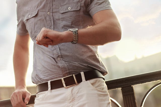 man looking at his watch